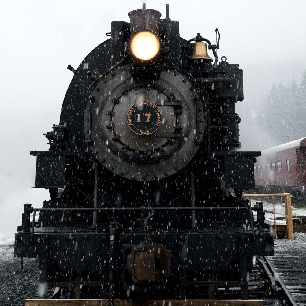 older looking train in the snow